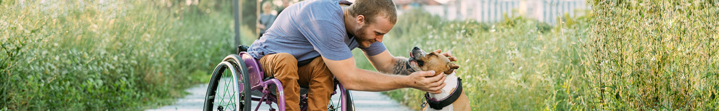 Man petting dog on head